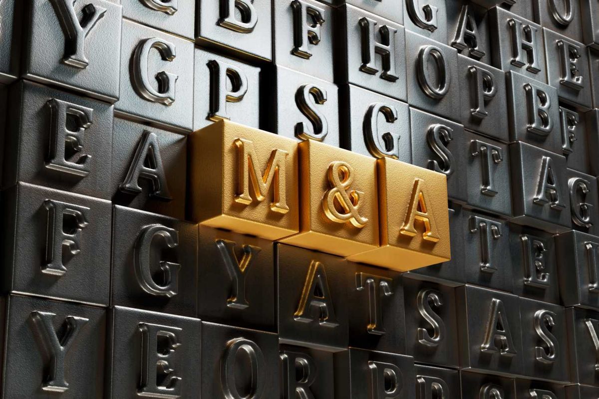Gold blocks with "M&A" among dark letter blocks.
