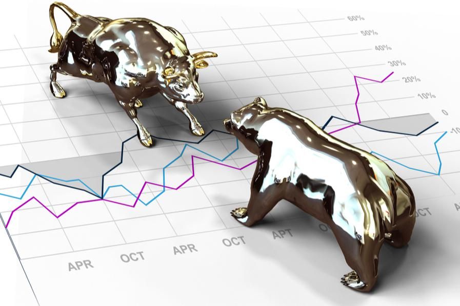 gold bull and bear with chart