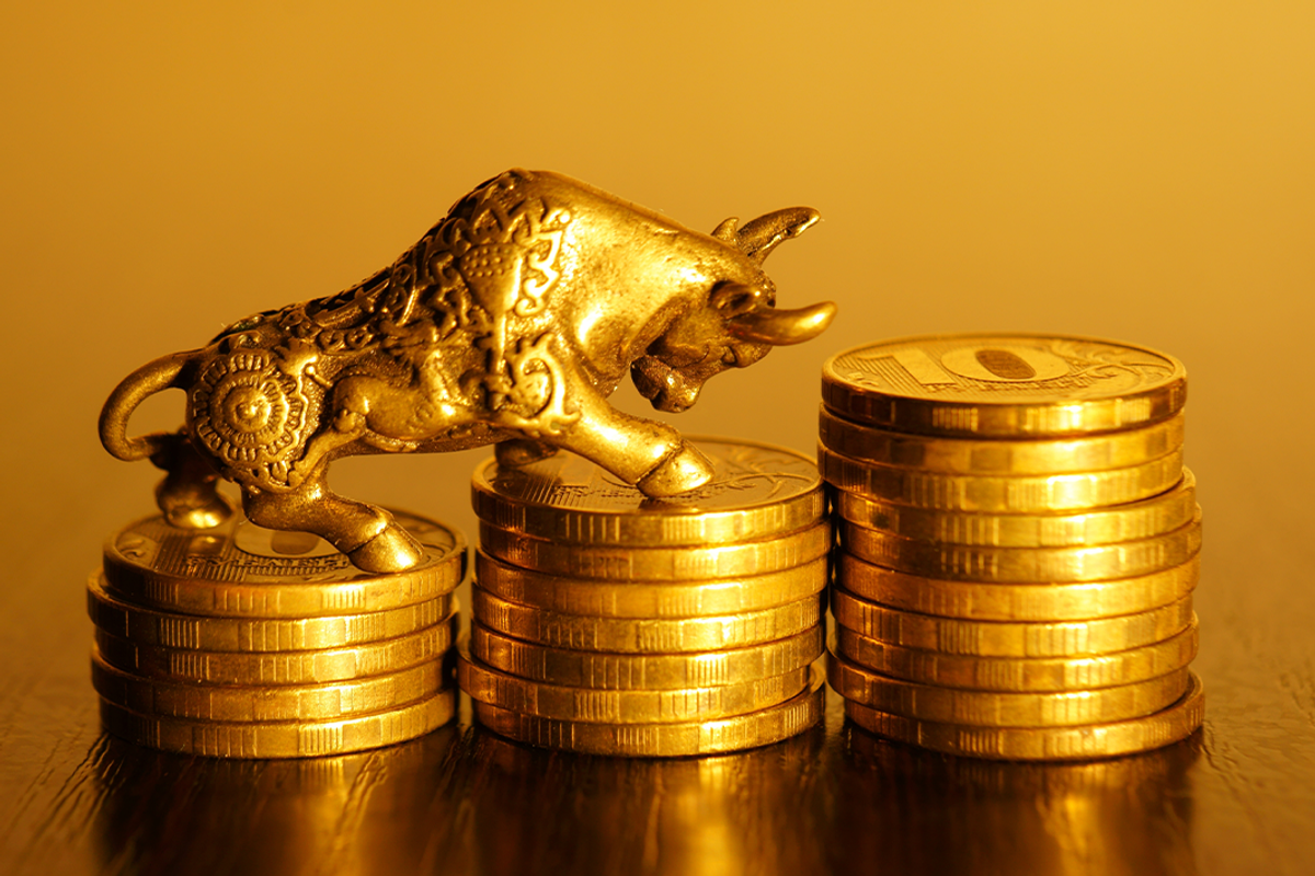 Gold bull on gold coins.