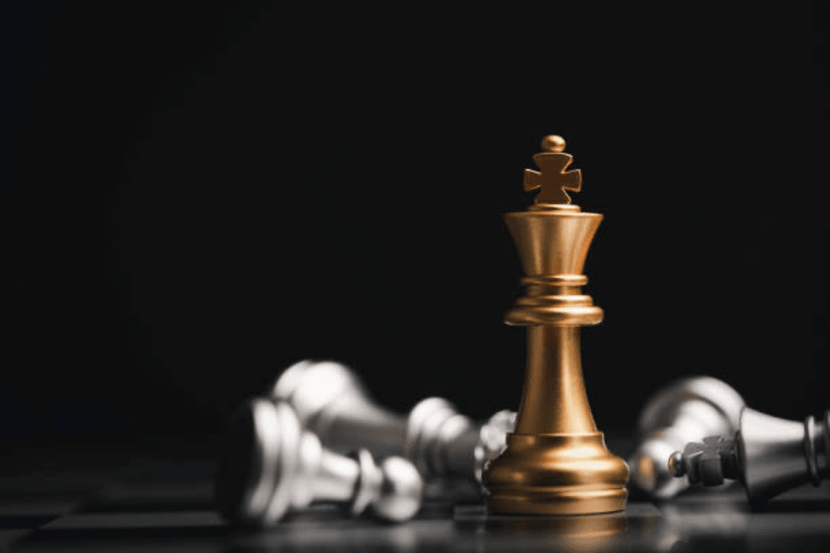 gold chess piece symbolizing strategy.