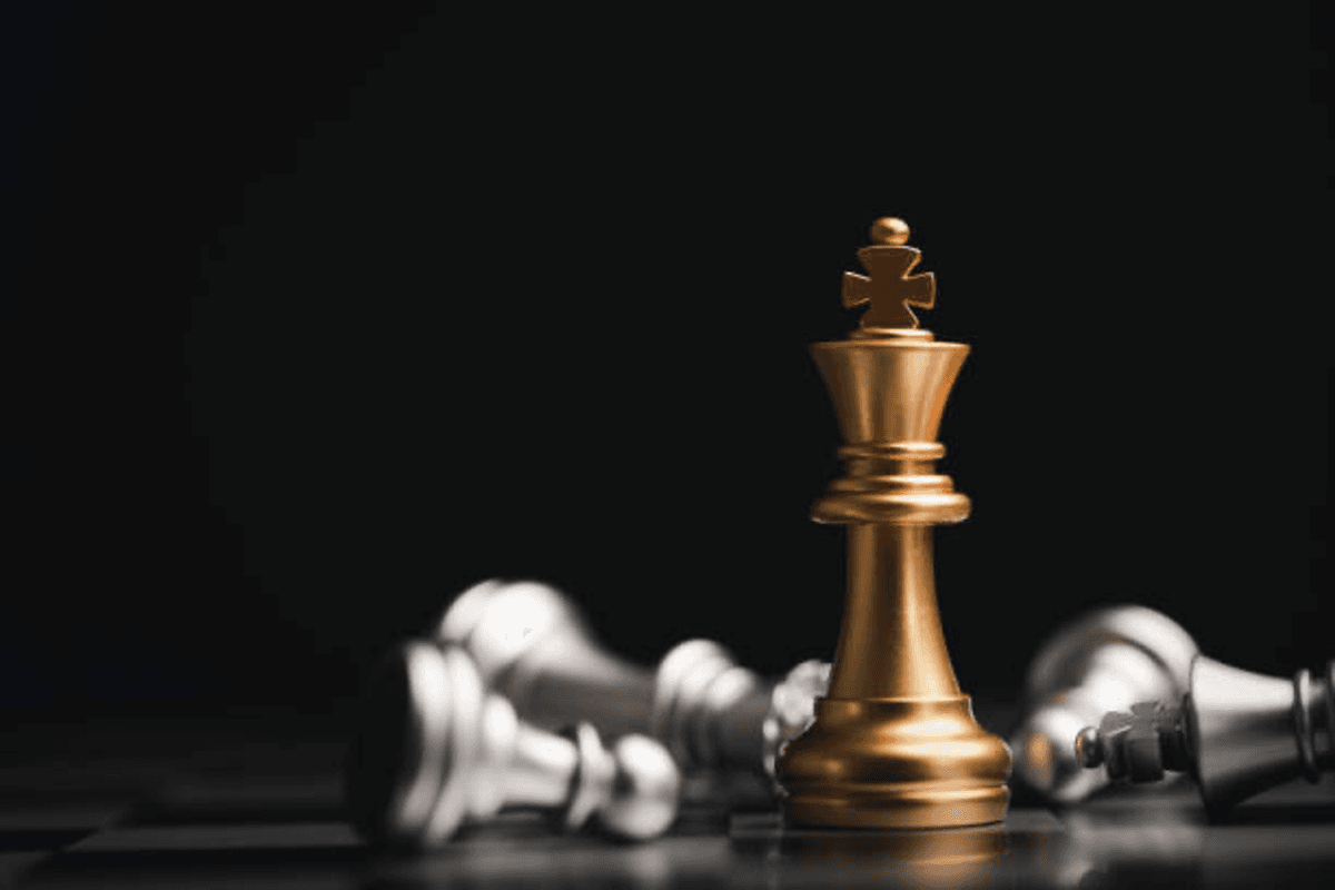 gold chess piece symbolizing strategy.
