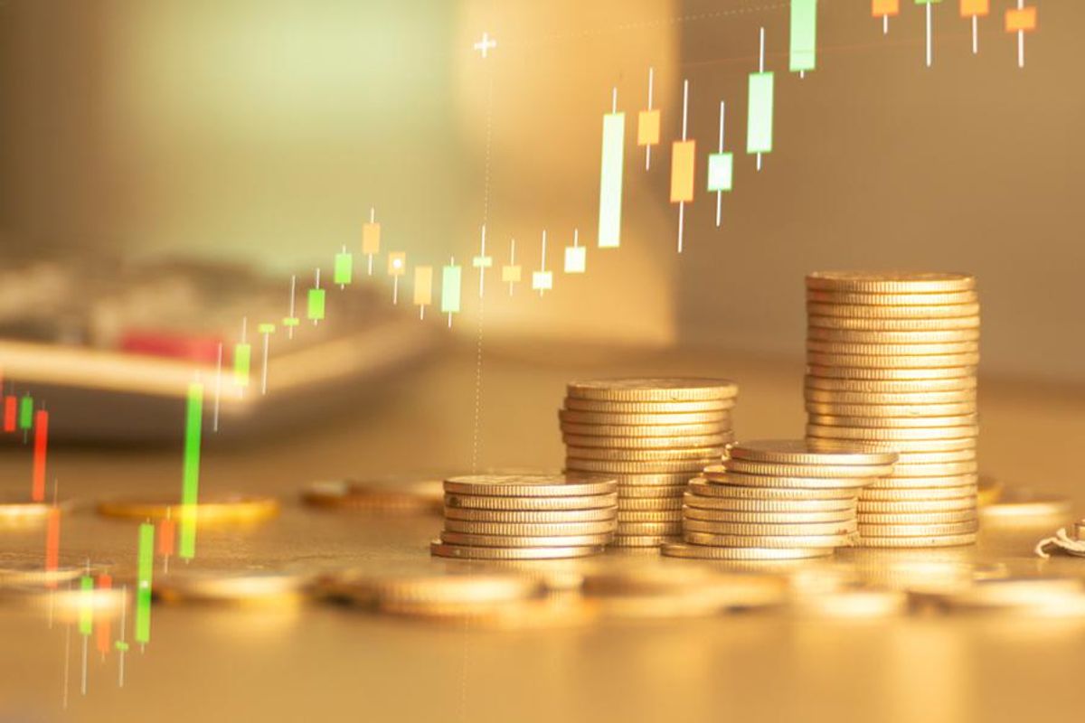 gold coins with price chart going up