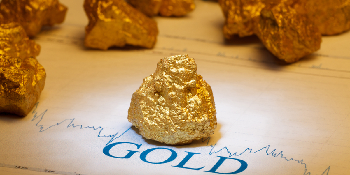 gold nugget with stock chart