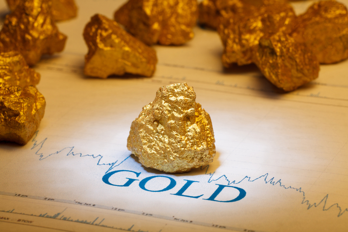 gold nugget with stock chart