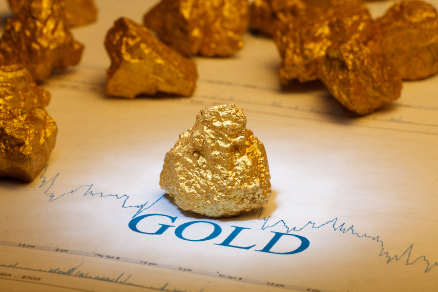 gold nugget with stock chart