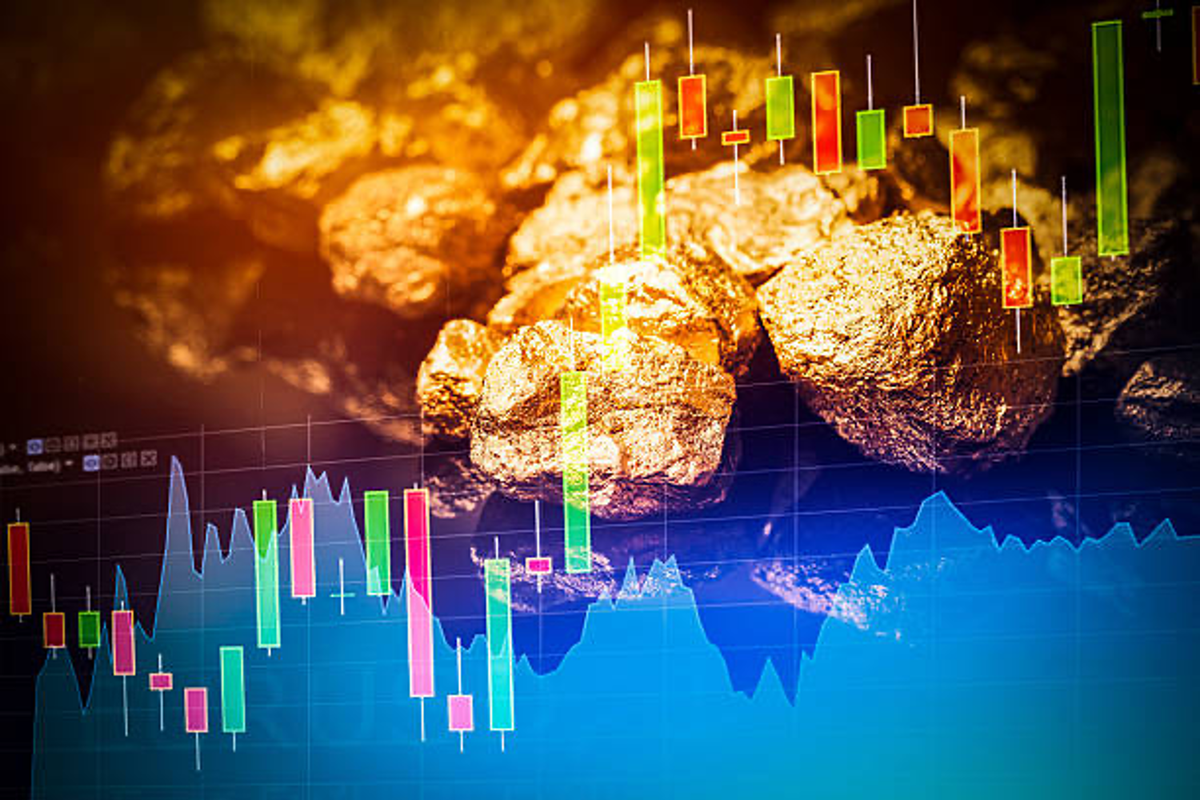 Gold nuggets and stock chart.
