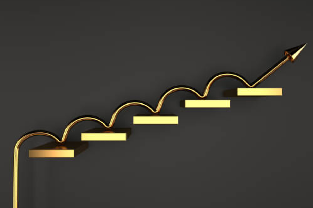Golden arrow and steps on dark background, symbolizing upward progress.