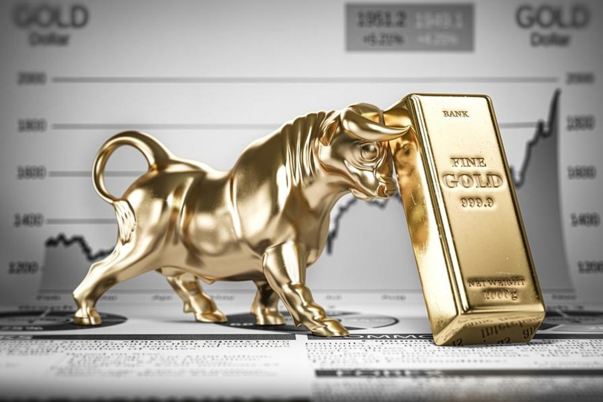 golden bull with gold bar and price chart