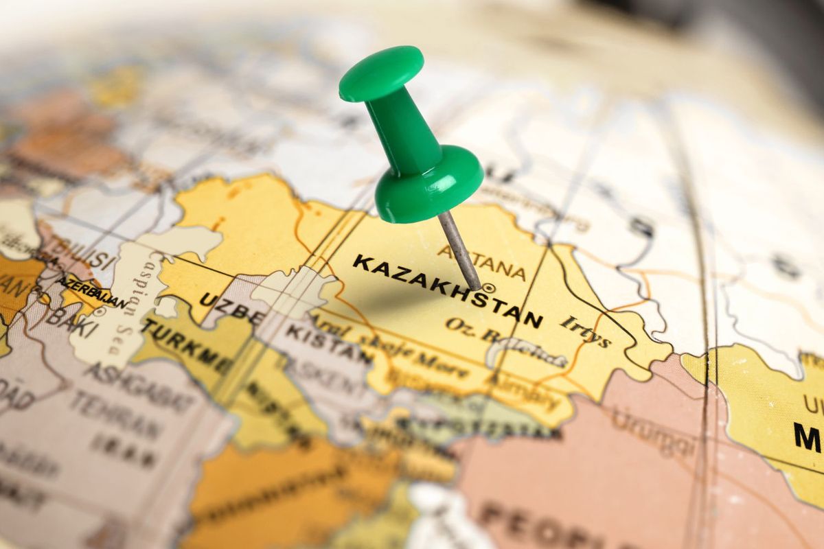 Green pin marking Kazakhstan on a map.