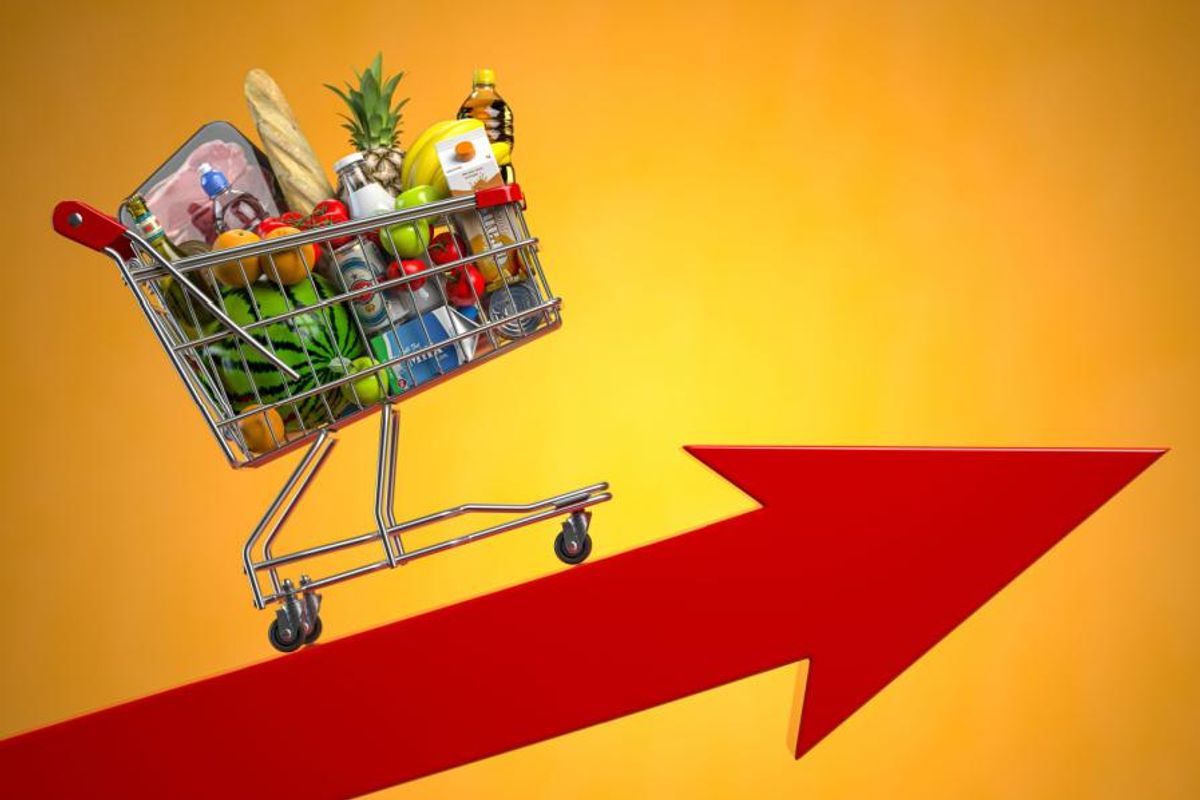 groceries in shopping cart with red up arrow