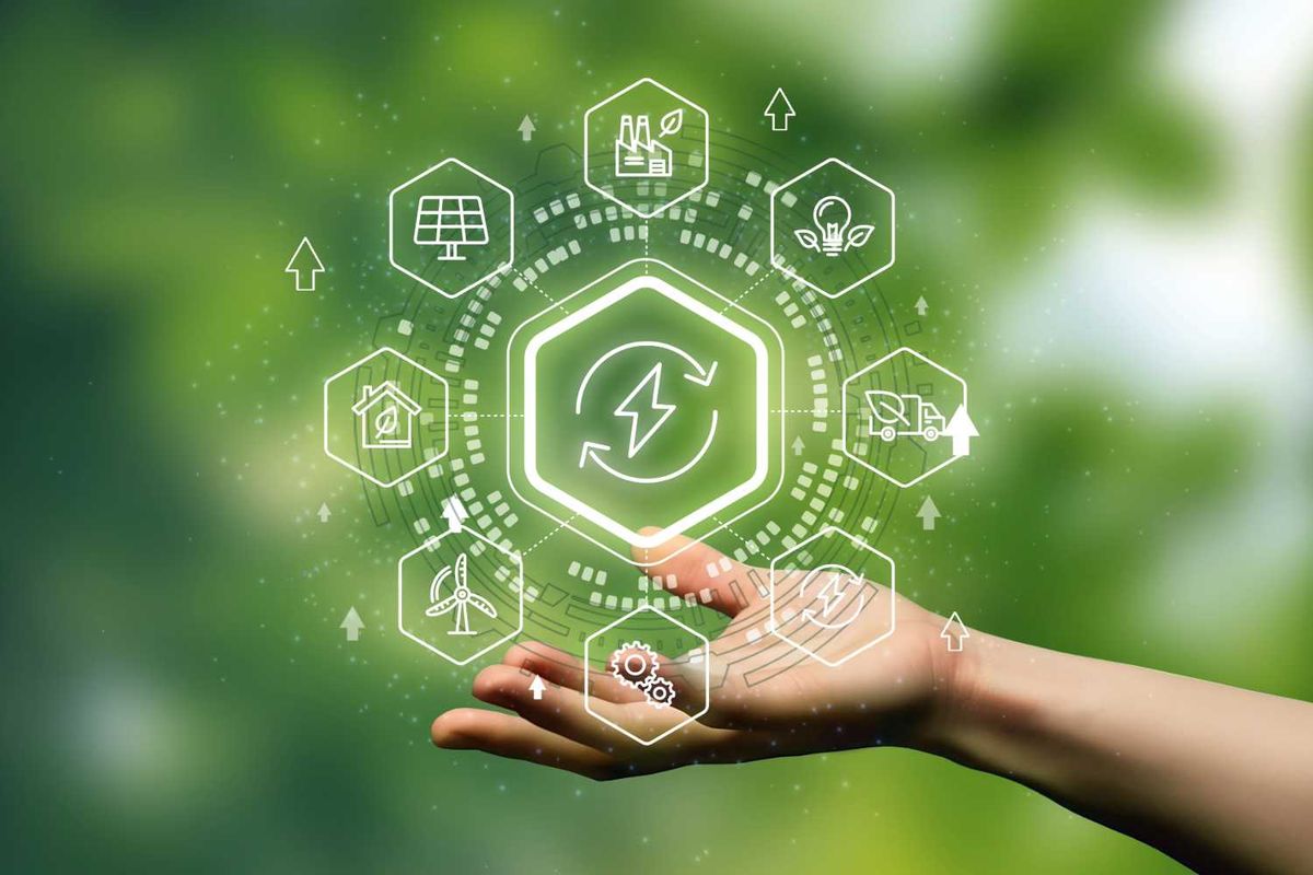 Hand holding digital eco-friendly icons over a green background.