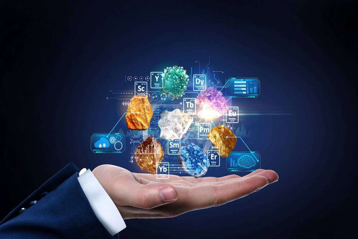 Hand holding levitating minerals with digital periodic table elements and data.