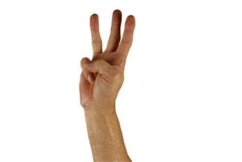 hand holding up three fingers