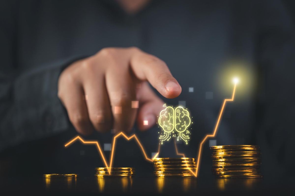 Hand pointing at AI brain icon over coins with a rising graph line.