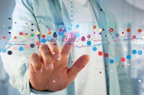 hand reaching out to touch digital stock chart