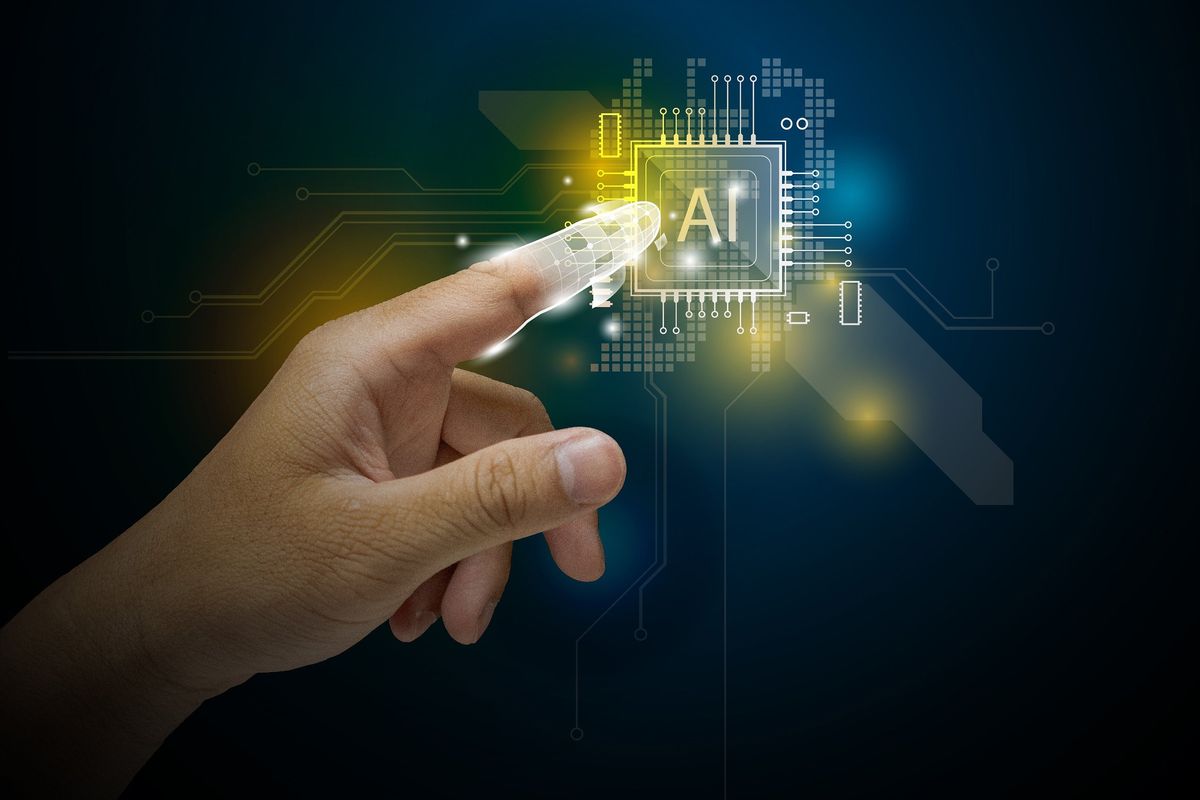 Hand touching AI chip.