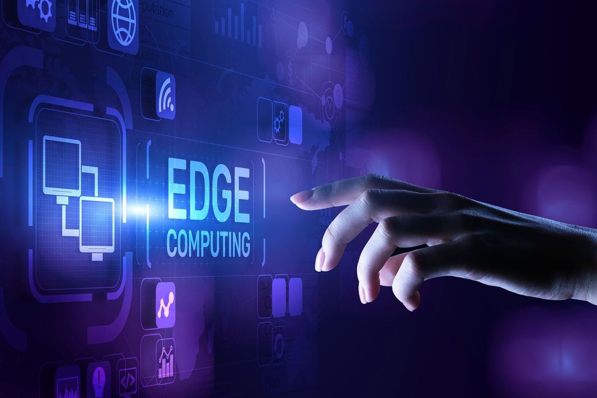 hand touching screen saying "edge computing" 
