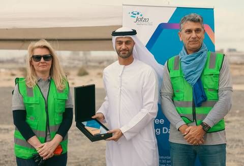 Hamad Al Sayegh, vice president, Customer Care, JAFZA (center) with PPG leaders Olga Kolevatova and Jean-Francois Lemaire at the inauguration of a tree-planting event in Dubai.