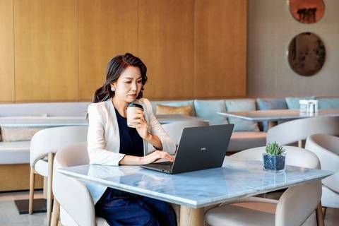 Woman working on a Dell Pro 14 Premium