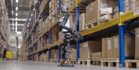 A humanoid robot checking for misplaced or improperly stacked items