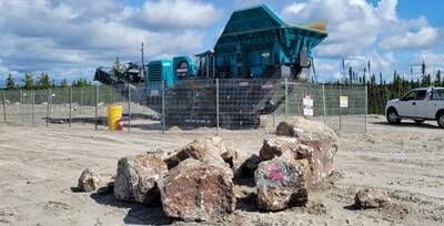 Figure 3: Spodumene pegmatite boulders ready for crusher located proximal to Camp Shaakichiuwaanaan. (CNW Group/PMET Resources Inc.)