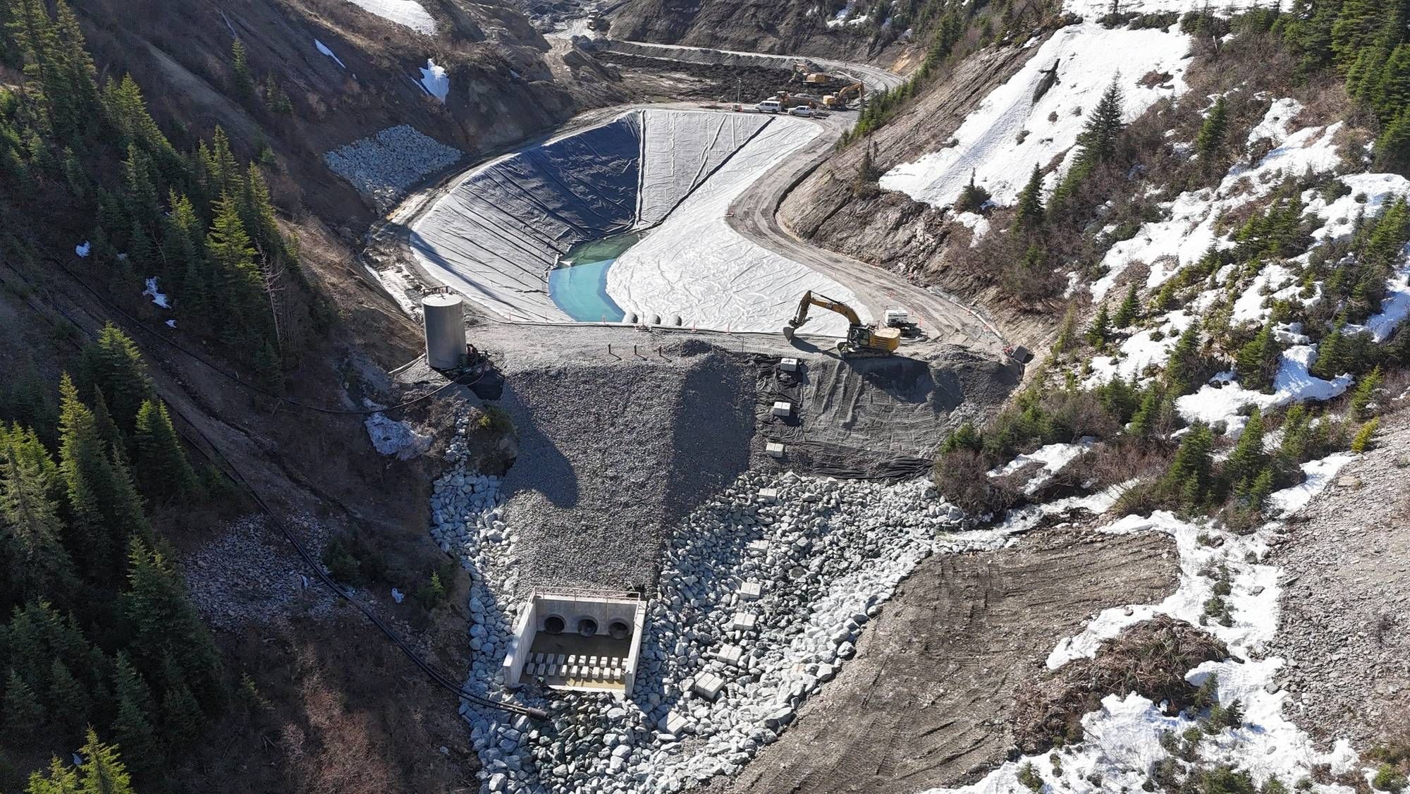 Sediment control pond (SCP) installed liner and placement of aggregates.