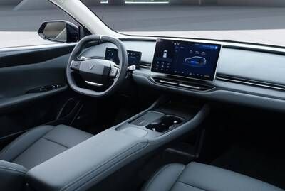 The 12.9-inch central display screen shows the vehicle's control features with sharp clarity.