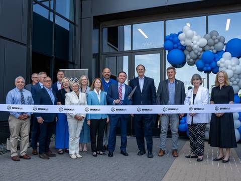 Ribbon-cutting ceremony at the grand opening of Stratasys' Americas Regional Corporate Headquarters in Minnetonka, Minnesota, with Stratasys leaders, partners, and community guests, including Rich Garrity, Scott and Lisa Crump.