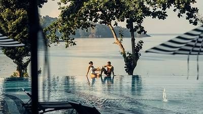 Couple in pool at Pullman Phuket, Thailand