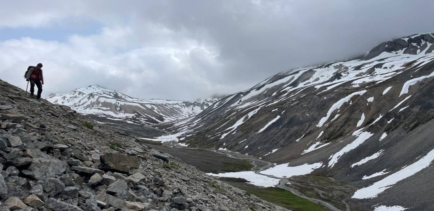 View looking south across the primary exploration valley at the Three Guardsmen Project, Yukon, where the 2026 induced polarization ("IP") survey and geological mapping program were completed.