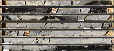 Photo 1: Grey Facies mineralization in TS25-003 laminated sphalerite and barite from 1,227.5 to 1,233.0 m