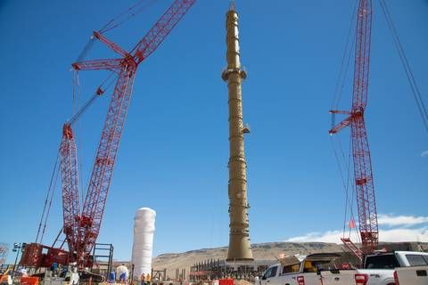 The 198-foot Duplex Plant Stack for the Sulfuric Acid Plant was safely raised and anchored into place.