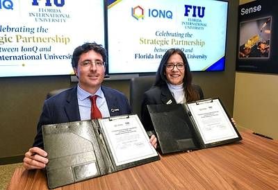 IonQ Chairman and CEO Niccolo de Masi and FIU Provost, Executive Vice President and Chief Operating Officer Elizabeth M. Béjar at IonQ headquarters in College Park, Maryland. (Photo credit: Taimy Alvarez/Florida International University)