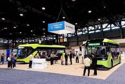 Visitors explore the electric buses at the VinFast booth. Visitors explore the electric buses at the VinFast booth.