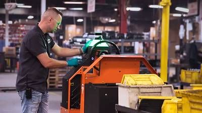 A worker at Coats sends the Autonomous DriveMod Tugger onto a new mission. With EasyLauch, customers are able to deploy autonomous vehicles without needing Capex approval. A worker at Coats sends the Autonomous DriveMod Tugger onto a new mission. With EasyLauch, customers are able to deploy autonomous vehicles without needing Capex approval.