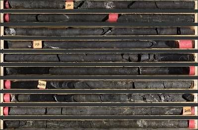 Photo 1: An interval of massive sulphide mineralization in TS26-007 consisting of massive sphalerite, and galena with minor barite and black mudstone from 193.7 to 204.1 m