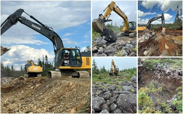 Excavator ditching and clearing along the exploration access road at Pipestone XL, with overburden and boulders pushed aside to open drainage across boggy ground (Fall 2026).
