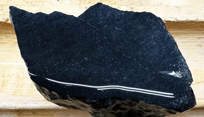 Surface sample from Alloy Max target area with visible disseminated awaruite nickel-cobalt alloy mineralization