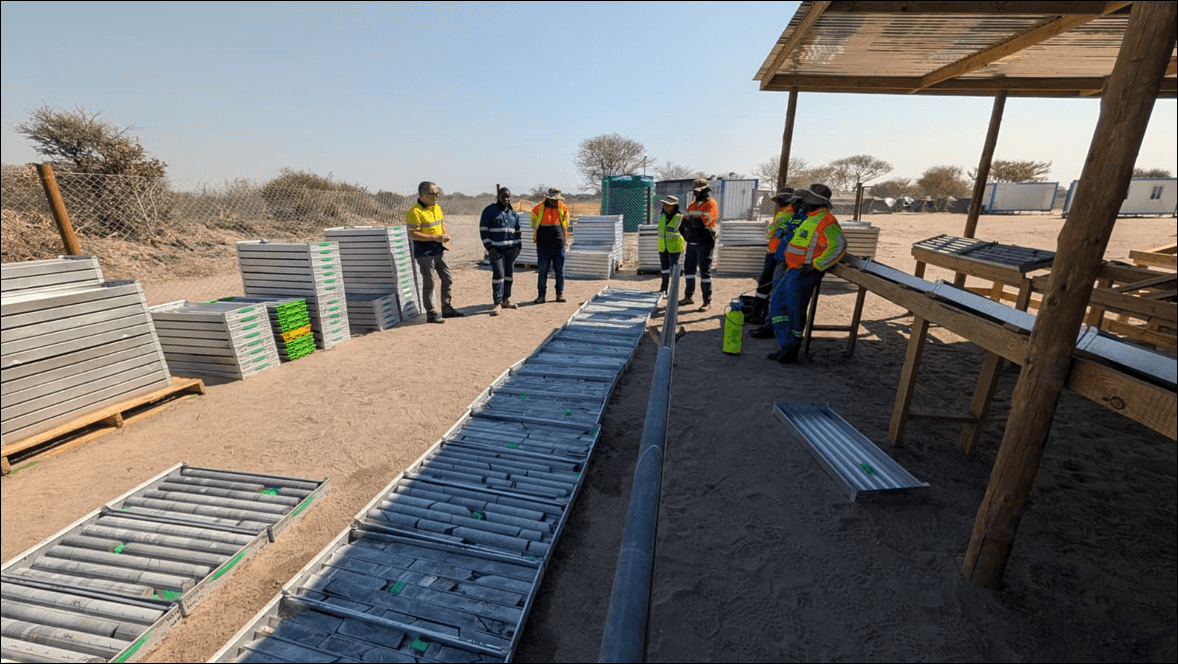 Figure 3: Core yard and geological team at Leviathan's Central Project; Mitchell Drilling camp operations in background.