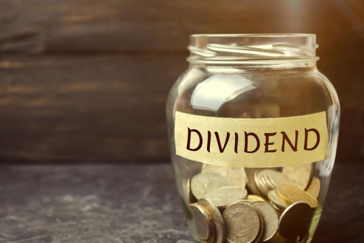 jar of coins labeled "dividend"