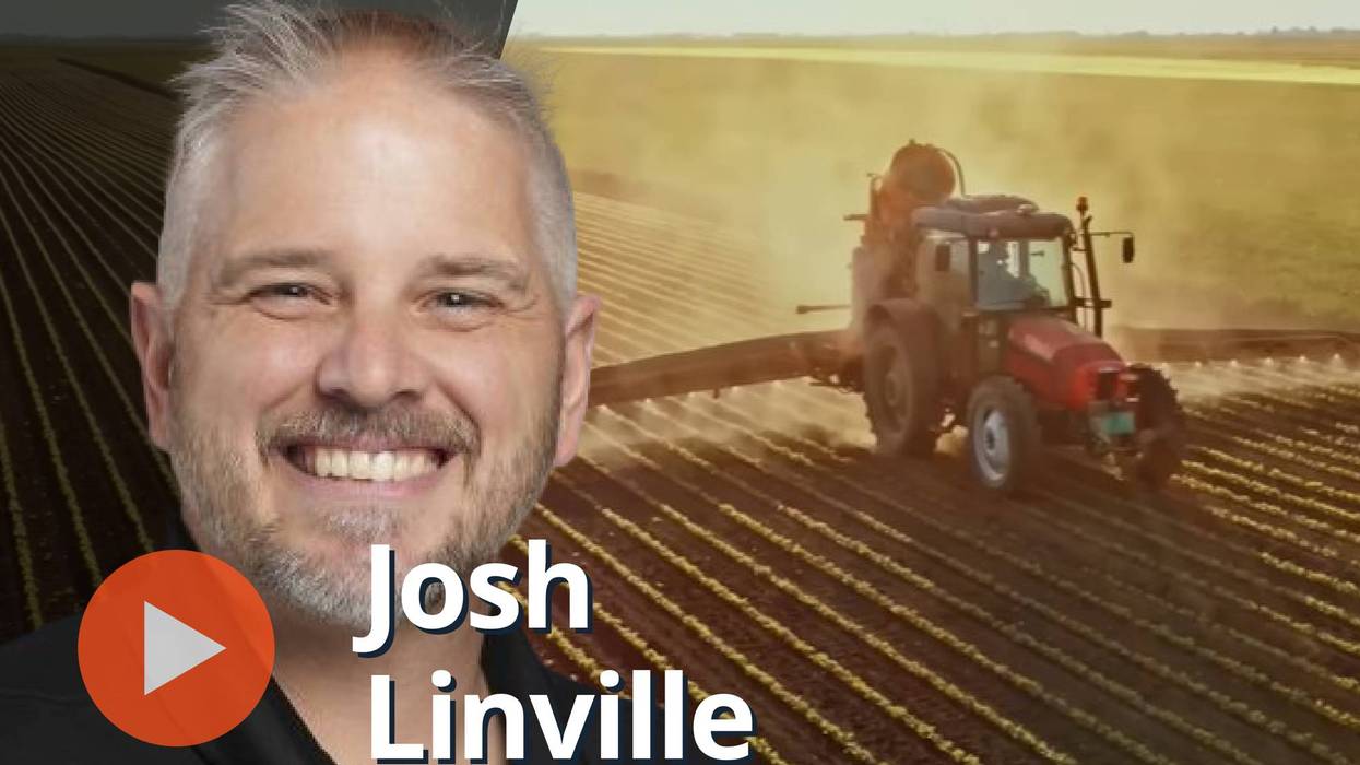 Josh Linville, tractor in field.