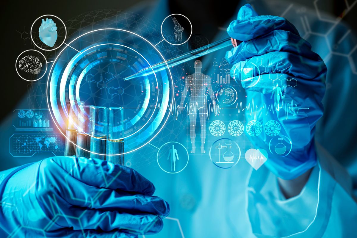 Lab worker holding test tubes.