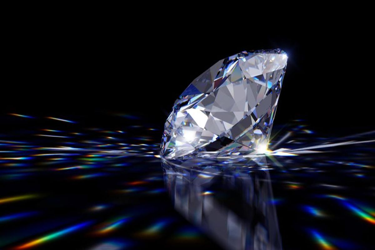 Large diamond glistening on black background