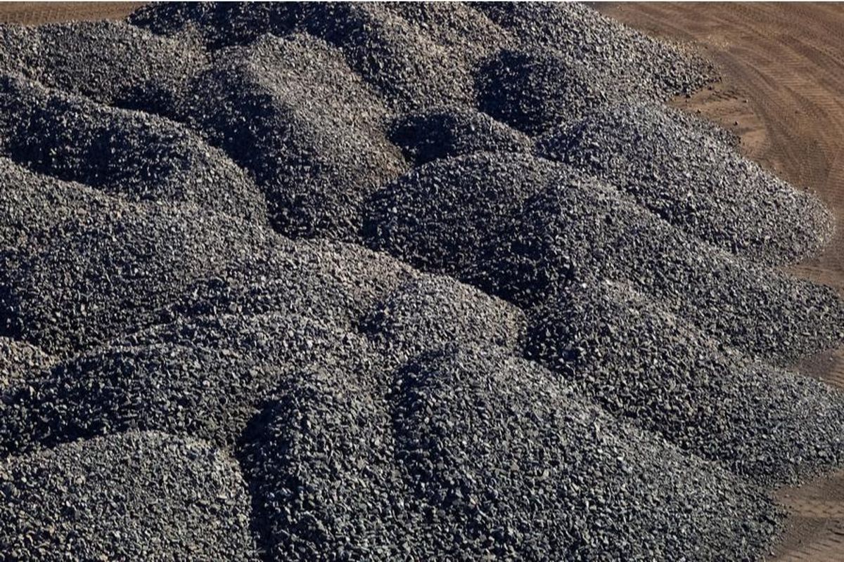 large piles of processed manganese-rich ore