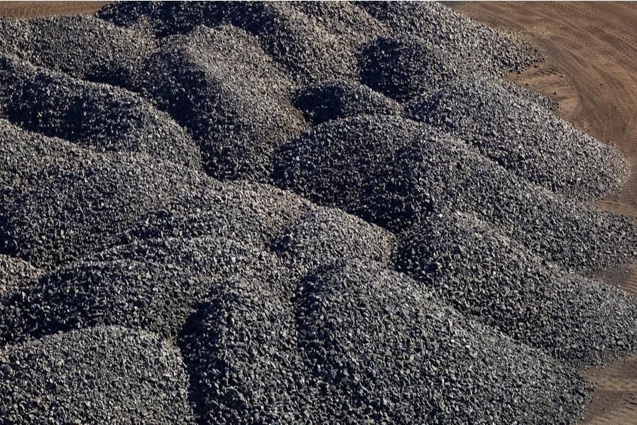 large piles of processed manganese-rich ore