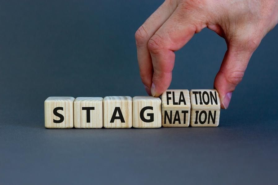 letter blocks turning from stagnation to stagflation