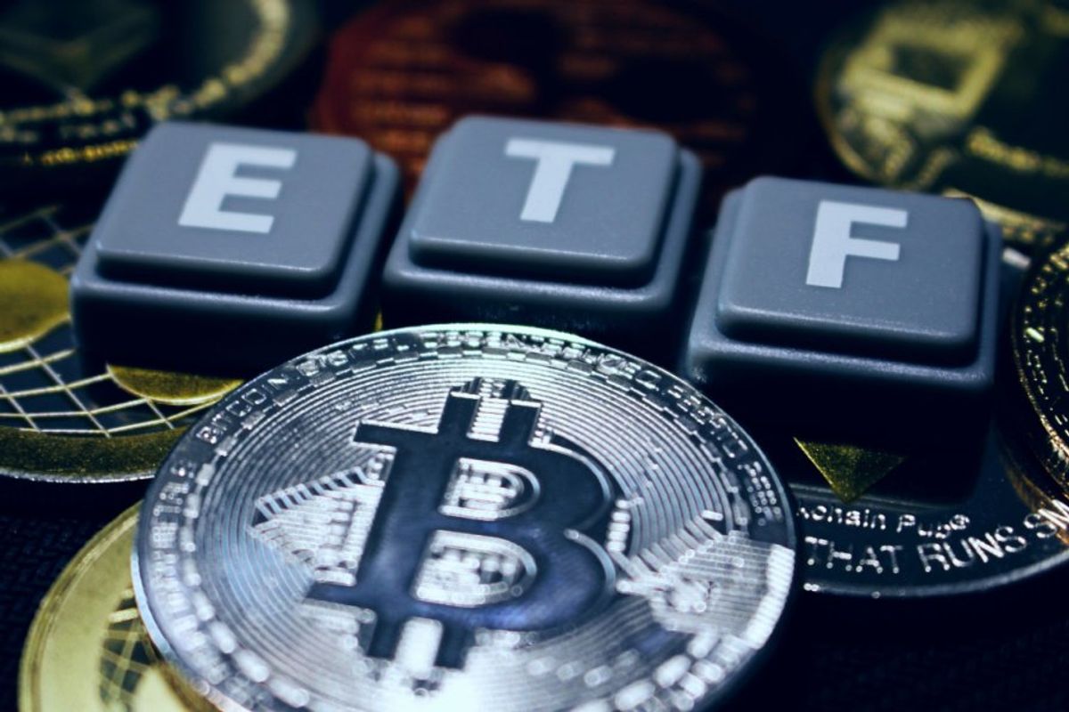 letters "ETF" above physical cryptocurrencies