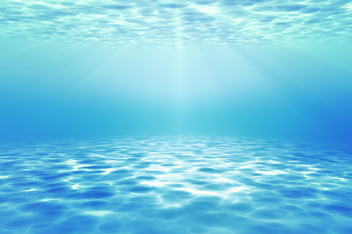 Light filtering under blue sea.