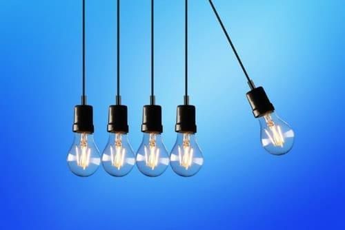 lightbulbs hanging against blue background