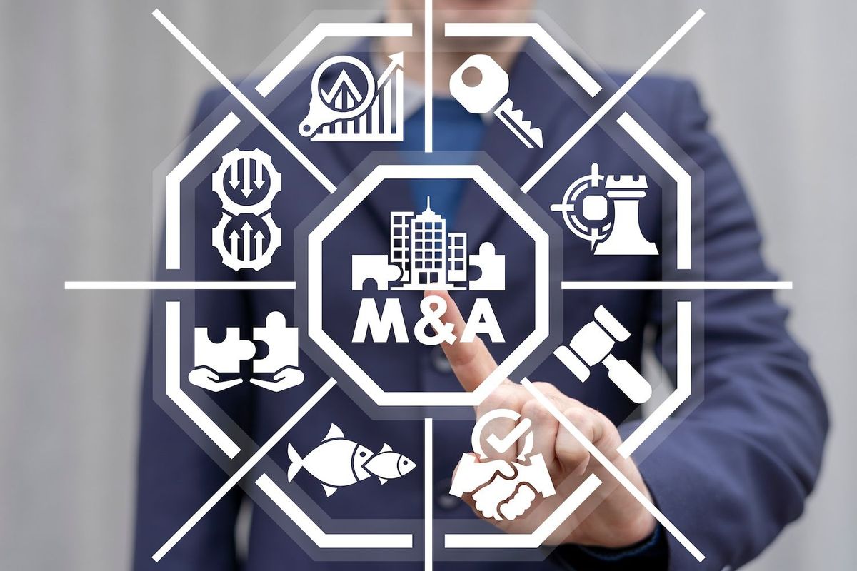 M&A concept with businessman in suit.